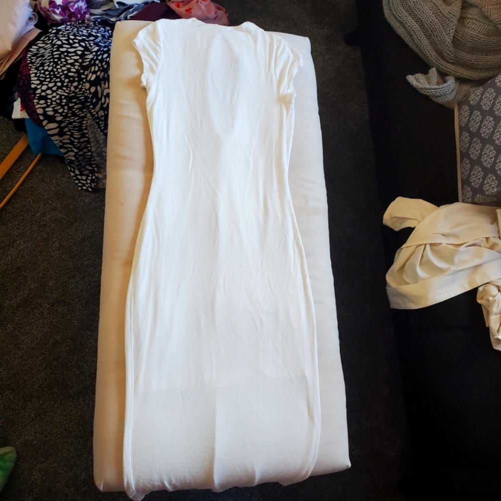 41. White bodycon midi dress with cutout